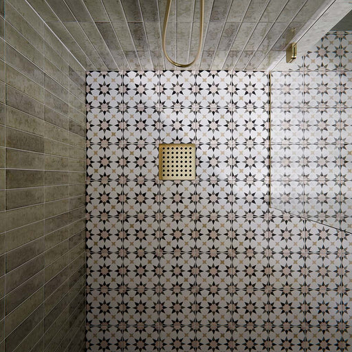 Shower floor featuring Agraba Natural 20×20cm Moroccan-style patterned tiles in soft neutral tones, laid to create a subtle geometric pattern that adds warmth, texture and visual interest to the bathroom.