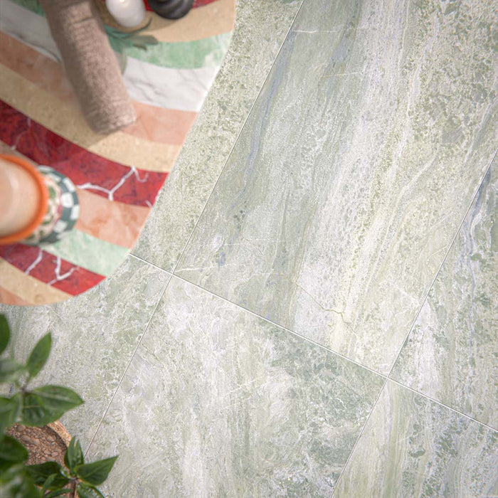Bathroom setting featuring Paradis Marble Verde 60x120cm marble effect floor tiles, showcasing soft green tones with natural veining, paired with vertically laid brick wall tiles and organic styling for a calm, spa-inspired finish.