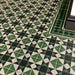  Close-up of Maison Green Decor Victorian patterned 20x20cm ceramic floor tiles in green, black and white geometric design.
