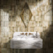 Bathroom interior featuring Fusion Bricks Moss Green 6.5x20cm ceramic wall tiles, arranged in a stacked layout with tonal variation, styled with a marble-effect basin, brass fittings, and a geometric mirror.