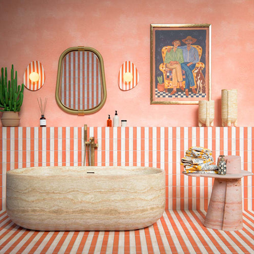 Bathroom setting featuring Atlas Canvas and Atlas Cotto Mini Brick 5x15cm matt wall and floor tiles, laid in a striped layout, showcasing warm neutral and terracotta tones, paired with a freestanding stone bath and brass fittings.