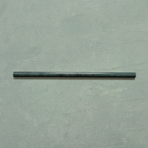 Izmir Green Gloss Pencil Bullnose Border Tile 1.2x30cm displayed on a soft green background, showing its slim curved edge and glossy handcrafted effect finish.