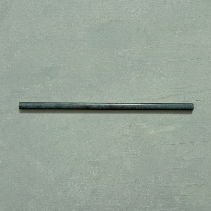 Izmir Green Gloss Pencil Bullnose Border Tile 1.2x30cm displayed on a soft green background, showing its slim curved edge and glossy handcrafted effect finish.