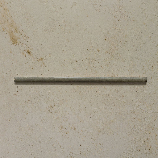 Izmir Sage Green Gloss Pencil Bullnose Border Tile 1.2x30cm displayed on a textured beige background, showing its slim rounded edge and glossy handcrafted effect finish.