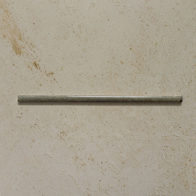 Izmir Sage Green Gloss Pencil Bullnose Border Tile 1.2x30cm displayed on a textured beige background, showing its slim rounded edge and glossy handcrafted effect finish.