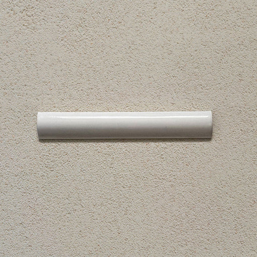 Madison White Bullnose Pencil Border Tile 3x20cm — a sleek finishing trim with a soft gloss sheen. Ideal for framing feature walls or providing a polished edge to tiled areas, adding a refined, handcrafted touch to any space.