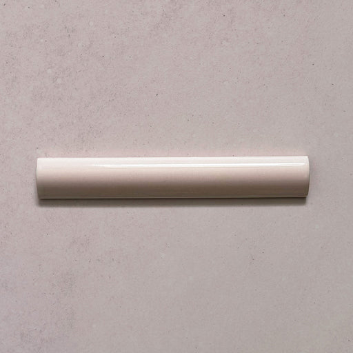 Zellij Pink Mist bullnose trim tile, 3cm x 20cm, soft blush pink tone, glossy glazed finish, smooth rounded edge, handcrafted Moroccan style.