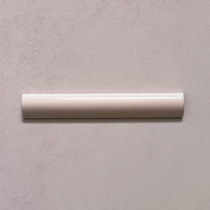 Zellij Pink Mist bullnose trim tile, 3cm x 20cm, soft blush pink tone, glossy glazed finish, smooth rounded edge, handcrafted Moroccan style.