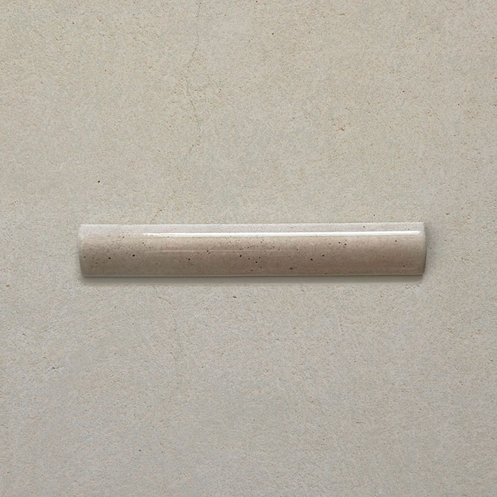 Madison Oatmeal Bullnose Pencil Border Tile 3x20cm — single piece shown. Its smooth rounded profile and soft oatmeal glaze offer a beautiful finishing touch for tiled walls, ideal for framing edges, recesses, or creating a seamless transition between surfaces.