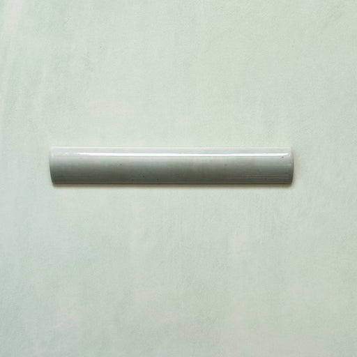 Madison Mint Green Bullnose Pencil Border Tiles 3x20cm — single bullnose piece showcasing its soft mint hue and glossy curved edge. Perfect for finishing walls with a refined, handcrafted touch that complements the Madison Mint Green collection.