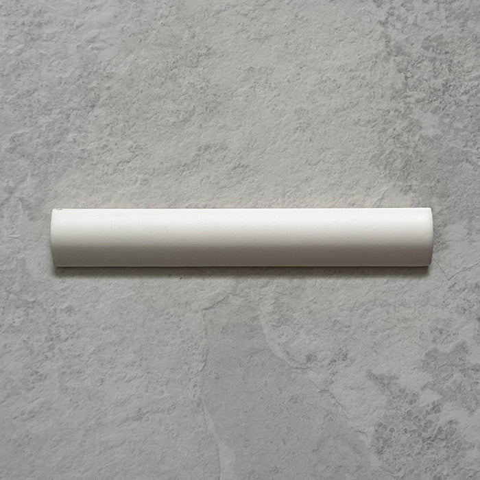 Zellij Chalk White Bullnose Moroccan-style trims in a 3cm x 20cm format, featuring a soft matt white finish and smooth rounded profile, displayed as a flat lay on a neutral stone-effect background.