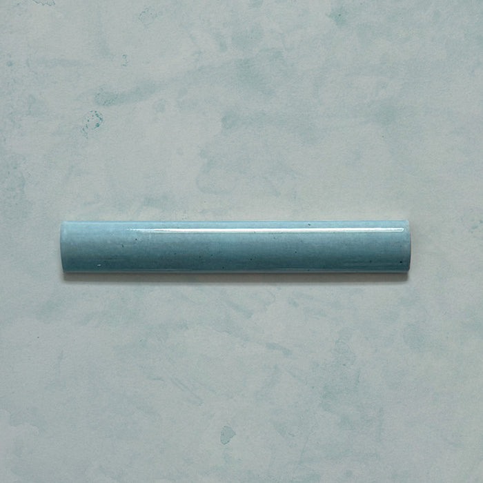 Madison Aquamarine Bullnose Pencil Border Tiles 3x20cm — single bullnose piece in a soft teal glaze, offering a smooth curved edge that adds a professional and polished finish. Perfect for framing tiled areas or completing wall designs with a cohesive, handcrafted touch.