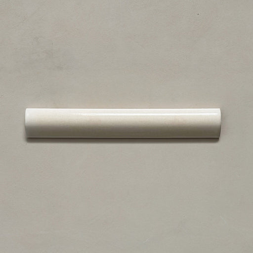 Zellij Bone bullnose tile in a 3cm x 20cm format, Moroccan style, featuring soft bone-beige tones, a glossy finish, and gentle handmade surface variation.