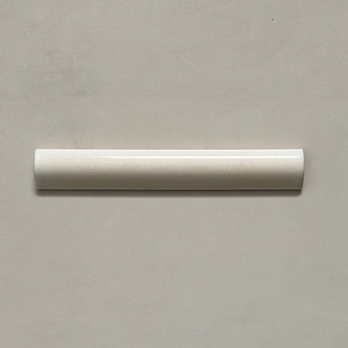 Zellij Bone bullnose tile in a 3cm x 20cm format, Moroccan style, featuring soft bone-beige tones, a glossy finish, and gentle handmade surface variation.