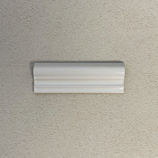 Finchley White ceramic dado trim tile in a 5 × 15cm format, featuring a crackle glaze finish that adds subtle texture and a decorative, classic detail to wall tile designs.