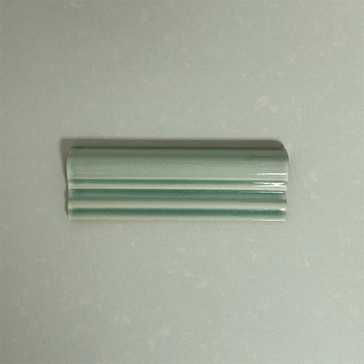 Finchley Lime Green ceramic dado trim tile in a 5 × 15cm format, featuring a crackle glaze finish that adds subtle texture and a decorative, classic detail to wall tile designs.