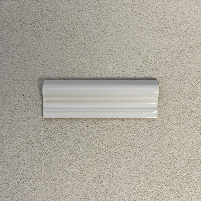 Finchley White ceramic dado trim tile in a 5 × 15cm format, featuring a crackle glaze finish that adds subtle texture and a decorative, classic detail to wall tile designs.