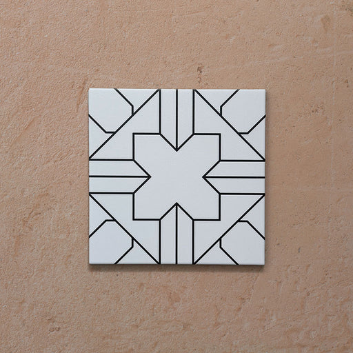 Alhambra Palacio 20x20cm Moroccan tile single tile shot, featuring a clean white background with an intricate black geometric cross pattern for a bold yet timeless design.