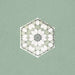 Maroush Green 18.7x21.6cm Moroccan single hexagonal tile featuring a geometric star and petal motif in soft green and white tones, inspired by traditional Moroccan craftsmanship.