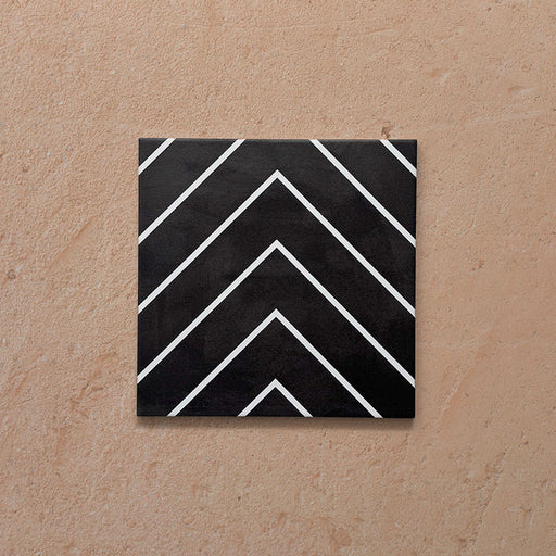 Alhambra Zig Zag Black 20x20cm Moroccan tile featuring a bold chevron design in black with crisp white lines, creating a modern geometric pattern perfect for contemporary interiors.