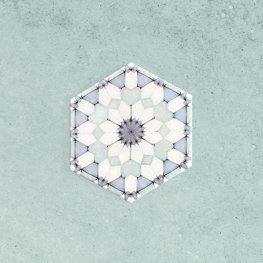 Maroush Frost Blue 18.7x21.6cm Moroccan hexagonal tile featuring a delicate geometric floral pattern in cool blue and white tones on a soft textured blue background.