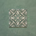 Cabana Flowers Moroccan Style 20x20cm single porcelain tile featuring an intricate floral and leaf motif in deep green and off-white with a vintage encaustic effect and smooth matt finish
