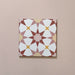 Close-up of Agraba Springs 20x20cm Moroccan-style ceramic tile featuring a geometric star pattern in terracotta, blush pink, mustard, and white tones on a soft pastel background.