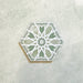 Maroush Mareshan Verde Green 18.7x21.6cm Moroccan hexagonal tile featuring a detailed white geometric star motif on a soft green background, inspired by classic Moroccan design.