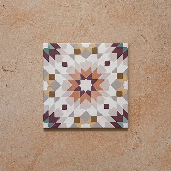 Cabana Manzanillo 20x20cm Moroccan-style porcelain tile featuring an intricate geometric star pattern in blush pink, mustard, terracotta, lilac, and turquoise tones on a soft matt finish background