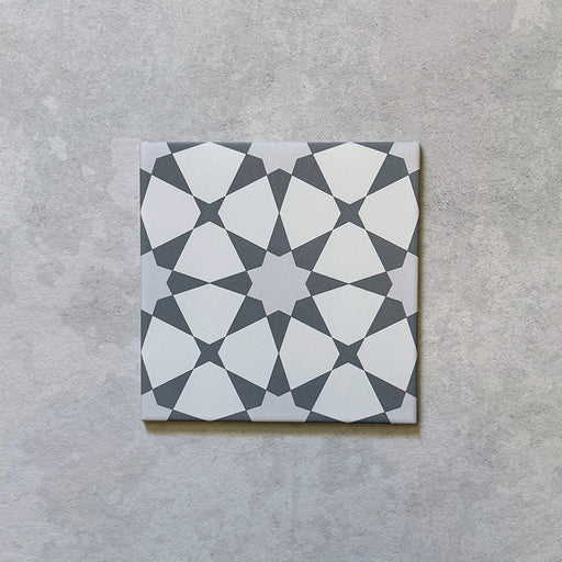 Product image of Agraba Silver 20cm x 20cm Moroccan style matt ceramic tile, featuring a soft silver and white geometric pattern inspired by traditional Moorish design, suitable for walls and floors, frost resistant and R11 anti-slip.