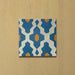 Cabana Zafini Mustard Azure 20x20cm Moroccan-style single porcelain tile with a geometric lattice pattern in deep azure blue and mustard yellow on a soft cream background with a matt finish.