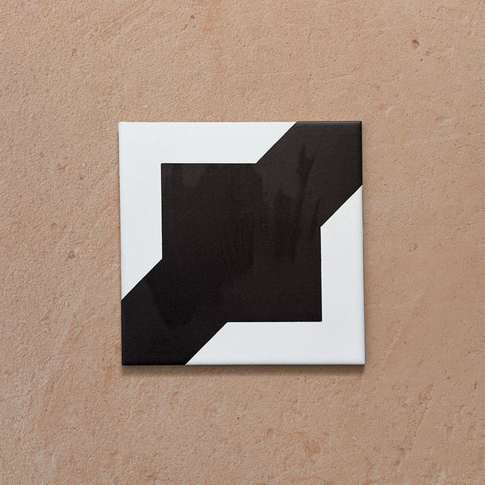 Alhambra Cathedral 20x20cm Moroccan tile single tile image showing a bold geometric black and white design with intersecting square and diagonal shapes — perfect for statement floors and feature walls.