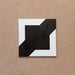 Alhambra Cathedral 20x20cm Moroccan tile single tile image showing a bold geometric black and white design with intersecting square and diagonal shapes — perfect for statement floors and feature walls.