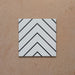 Alhambra Zig Zag Blanco 20x20cm Moroccan tile featuring a bold black chevron pattern on a white background, showcasing its modern geometric design and smooth matte finish.