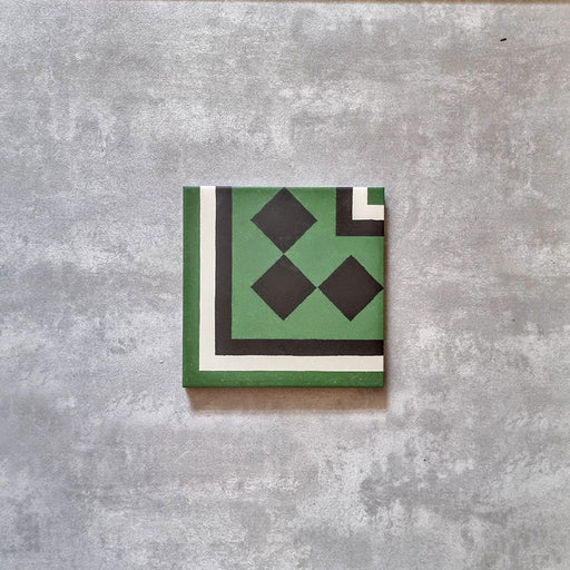 Maison Green Victorian Corner 20cm x 20cm, Victorian corner floor tile, geometric corner and diamond motif, green, black and white colour palette, matt finish, classic heritage Victorian design.