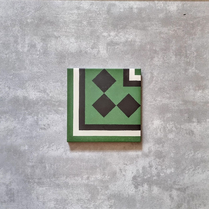 Maison Green Victorian Corner 20cm x 20cm, Victorian corner floor tile, geometric corner and diamond motif, green, black and white colour palette, matt finish, classic heritage Victorian design.