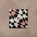 Cabana Mexico City Rose Moroccan Style 20x20cm single tile featuring a geometric pattern with angular shapes in rose pink, chocolate brown, white, black, and light grey tones with a smooth matt finish