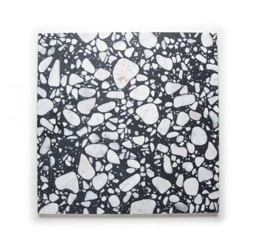Single Noventa Terrazzo Nero 59x59cm matt porcelain wall and floor tile displayed against a neutral background, showcasing a bold terrazzo effect with contrasting white stone fragments set within a deep black base, highlighting variation in scale and organic detailing across the surface.