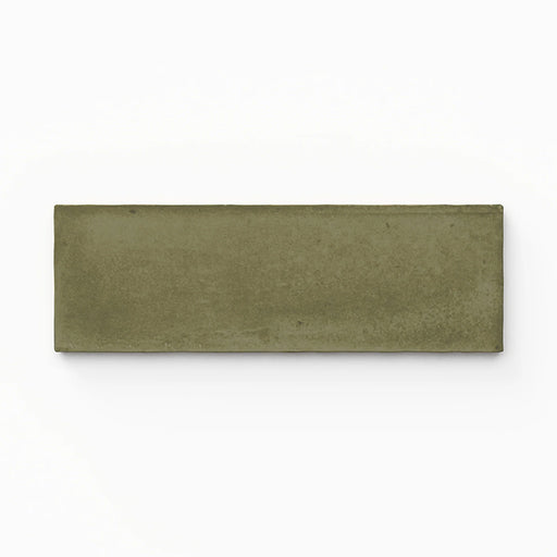 Single Atlas Verde Mini Brick 5x15cm matt wall tile, showcasing a rich green tone with a subtle textured surface and soft variation, presented in a clean, minimal close-up product view.