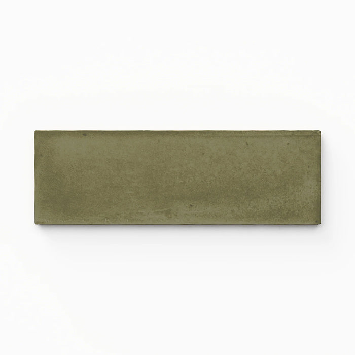 Single Atlas Verde Mini Brick 5x15cm matt wall tile, showcasing a rich green tone with a subtle textured surface and soft variation, presented in a clean, minimal close-up product view.