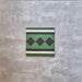 Maison Green Victorian Side/Border 20cm x 20cm, decorative Victorian border tile with geometric diamond motif, deep green, black and white colour palette, matt finish, heritage-style patterned floor tile.