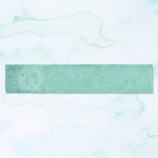 Single Malaga Aqua Brick gloss wall tile in 6.5x32.8cm format, featuring soft aqua and sea-green tonal variation with a glossy finish, displayed individually against a light background to highlight surface movement and shade detail.