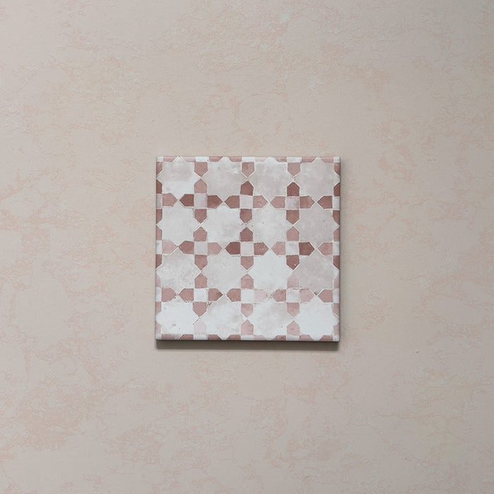 Bedouin Mequinez Rose Moroccan-style 15x15cm single tile featuring a soft geometric pattern in rose pink, blush beige, and white tones with a handcrafted matte finish and delicate textured surface.
