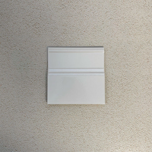 Finchley White 15 × 15cm ceramic skirting tile with a crackle glaze finish, designed to create a smooth, decorative transition between wall and floor in classic interior spaces.