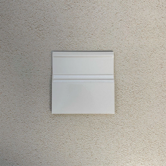 Finchley White 15 × 15cm ceramic skirting tile with a crackle glaze finish, designed to create a smooth, decorative transition between wall and floor in classic interior spaces.