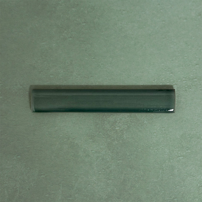 Finchley Golders Green ceramic pencil trim tile in a 2.5 × 15cm format, featuring a crackle glaze finish that adds subtle texture and a refined decorative edge to wall tile designs.