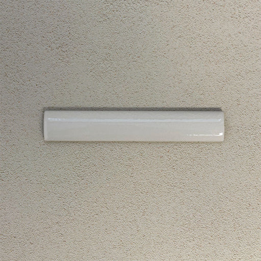 Finchley White ceramic pencil trim tile in a 2.5 × 15cm format, featuring a crackle glaze finish that adds subtle texture and a refined decorative edge to wall tile installations.