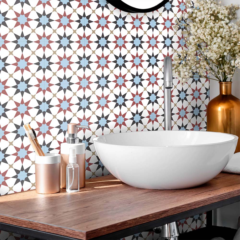 Bathroom featuring Agraba Mini Atlas 15x15cm Moroccan-style ceramic wall tiles in blue, terracotta, and white tones, styled with a modern round basin, wooden countertop, and metallic accents for a contemporary finish.