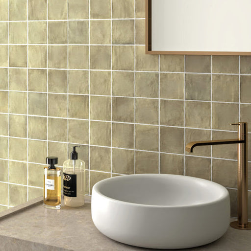 Zellij Weald Green Square Moroccan Style 10cm x 10cm bathroom sink setting, square wall tiles in muted weald green with soft earthy undertones, subtle tonal variation, glossy glazed finish, and a handcrafted Moroccan-inspired look paired with a modern countertop basin.