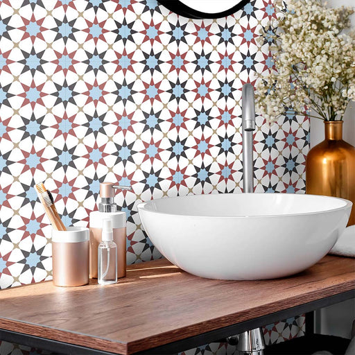 Bathroom featuring Agraba Mini Atlas 15x15cm Moroccan-style ceramic wall tiles in blue, terracotta, and white tones, styled with a modern round basin, wooden countertop, and metallic accents for a contemporary finish.